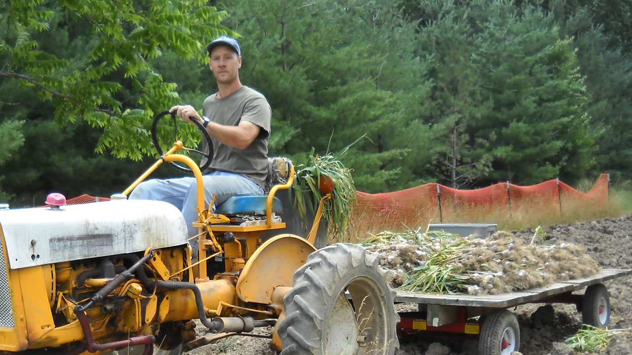farmer riding on tractor